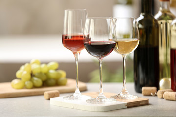 Different glasses with wine served on table - obrazy, fototapety, plakaty