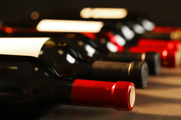 Bottles of different wines, closeup. Expensive collection