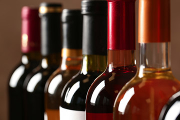 Bottles of different wines, closeup. Expensive collection