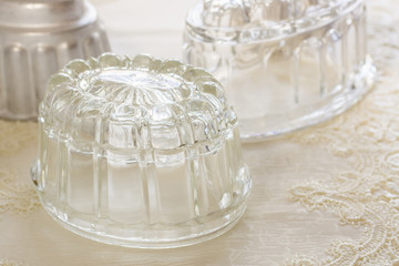 Old fashioned glass and aluminum jelly or blancmange moulds for making traditional jellies