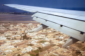 View from a window of passenger plane during flight above Monastir city, Tunisia