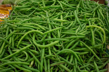 A background filled with green beans