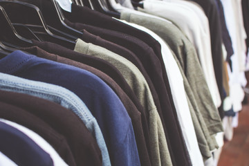 Several shirts on a rack