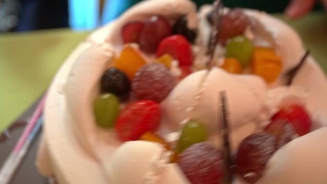 top view closeup on white cream cake with chocolate and fruits