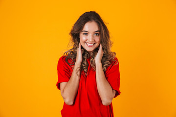 Portrait of a lovely cheerful young woman standing