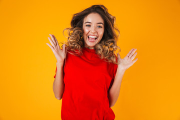 Portrait of a lovely cheerful young woman standing