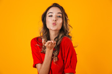 Portrait of a lovely cheerful young woman standing