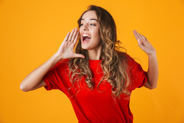 Portrait of a lovely cheerful young woman standing