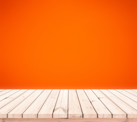 old wood plank with abstract orange blurred background for product display