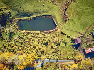Scenic landscape with farm at autumn in Woodstock, Vermont, USA. Fall in New England. Aerial drone shot.