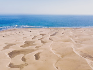 Fototapeta na wymiar Sand dunes aerial view, Maspalomas from above, Gran Canaria beach, Spain