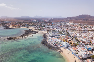 Fototapeta na wymiar Corralejo aerial cityscape, port city in Fuerteventura, beautiful panoramic view of Canary islands, Spain