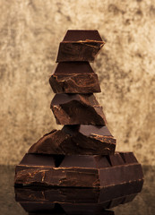 Dark chocolate on a stone background
