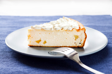 Homemade cottage cheese and semolina cake with kiwi fruit and cream