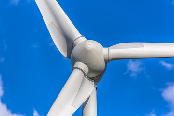 Detailed close up view of a wind turbines; generator, rotor and blade view