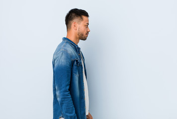 Fototapeta premium Young handsome filipino man gazing left, sideways pose.