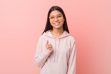 Fototapeta premium Young pretty arab woman wearing a casual sport look smiling and raising thumb up