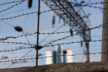 Abandoned hotel Odessa through the barbed wire fence. Odessa. Ukraine