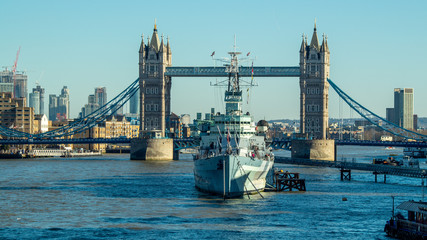 Obraz premium London the river Thames showing city skyline and featuring HMS Belfast and Tower Bridge