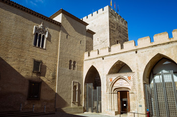 Fototapeta na wymiar Zaragoza, Aragon, Spain - February 14th, 2019 : Aragonese Courtyard, Troubadour Tower and Chapel of San Martin within the Aljaferia Palace complex.