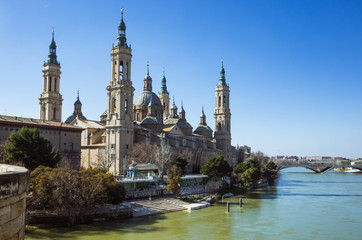 Zaragoza, Aragon, Spain - February 14th, 2019 : Basilica of Our Lady of the Pillar by the river Ebro. It is reputed to be the first church dedicated to Mary in history.