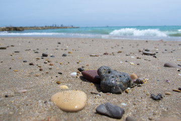 Sea stones on the beach sand