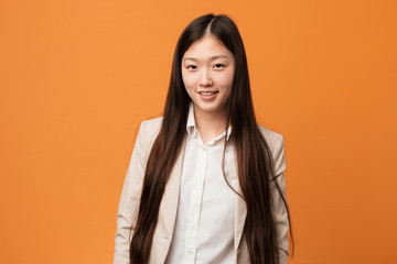 Fototapeta premium Young business chinese woman happy, smiling and cheerful.