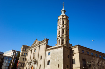 Fototapeta premium Zaragoza, Aragon, Spain - February 14th, 2019 : Baroque church and bell tower of San Juan de los Panetes at Plaza del Pilar square.