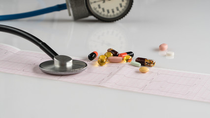 medical stethoscope with tonometer and ecg on a light background