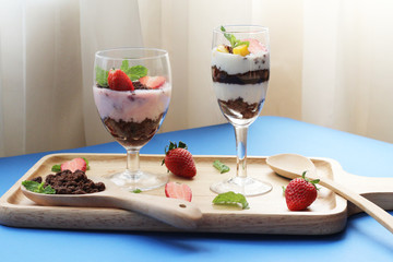 Beautiful food set of layer of milk Yogurt with topping by strawberry and brown cracker