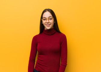 Intellectual young girl cheerful with a big smile