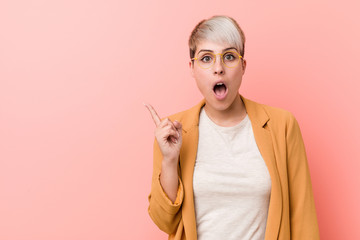 Obraz premium Young caucasian woman wearing a casual business clothes pointing to the side