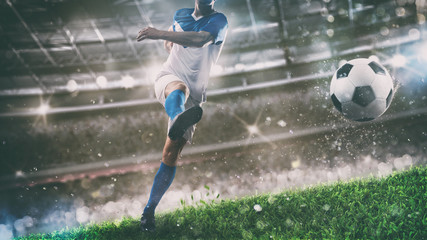 Fototapeta premium Football scene at night match with player kicking the ball with power