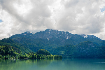 Naklejka na ściany i meble photography of a lake with big mountain at horizon
