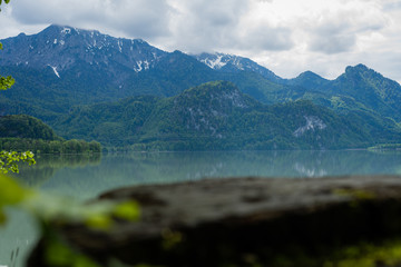 Naklejka na ściany i meble view over wood to lake and mountain in bavaria