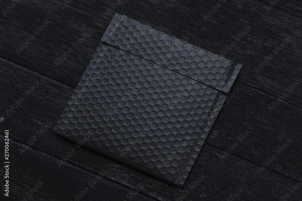 Poster black packet on black background. 3d rendering. copy space. empty space.