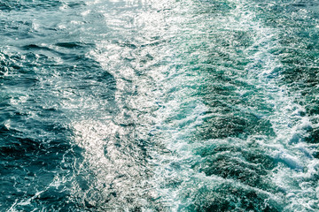 Track from the ship on the water, close-up. Space for text. Background.