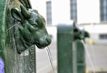 A triptych of drinking water fountains