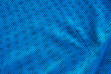 Fototapeta na wymiar Blue fabric sport clothing football jersey with air mesh texture background