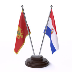 Montenegro and Paraguay, two table flags isolated on white background. 3d image