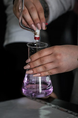 Pouring chemicals in a laboratory biology microbiology science 