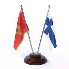 Montenegro and Finland, two table flags isolated on white background. 3d image