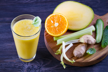 Mango Orange Ginger Cucumber and Celery Smoothie. Fruit and Vegetable Smoothie - healthy diet and detox drink. horizontal