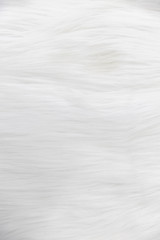 Fototapeta na wymiar close-up of soft beige fluffy fur, wool, carpet texture background.