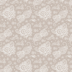 Beige background ornate white patterns. Seamless pattern.