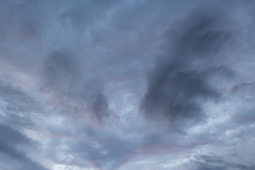 Naklejka na ściany i meble textured clouds in the sky at dusk