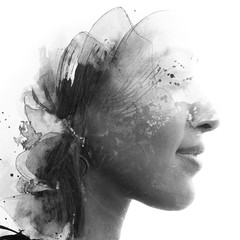 Paintography. Double Exposure portrait of a beautiful ethnic woman's profile combined with hand...