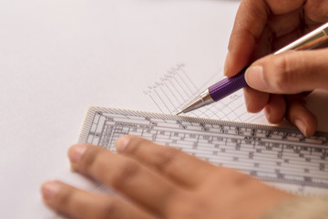 Person Drawing On A White Sheet