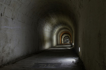 Fototapeta na wymiar A dark, deserted underground tunnel