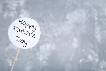 Text Happy Fathers Day on grey background